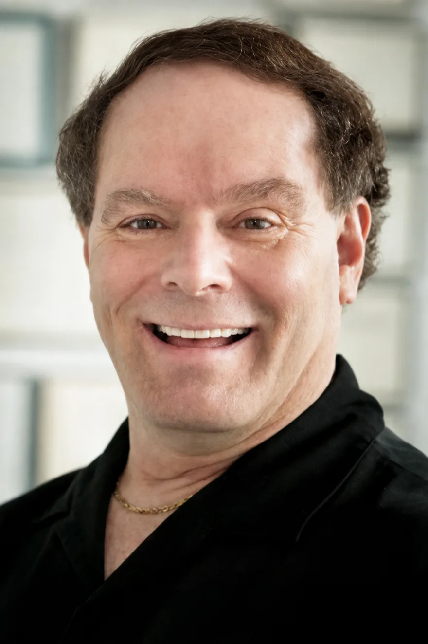 Dr. Gary J. Barsky, M.D., board-certified dermatologist, smiling in a portrait photograph.